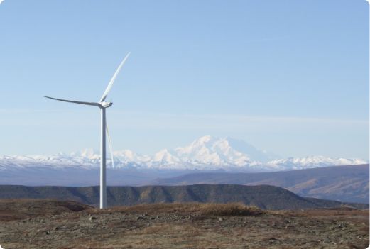 wind turbine with mountains in the distance